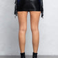 CHELSIE FRINGE LEATHER MINI SKIRT W/ STUDS