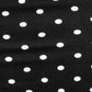 Black fabric with white polka dots