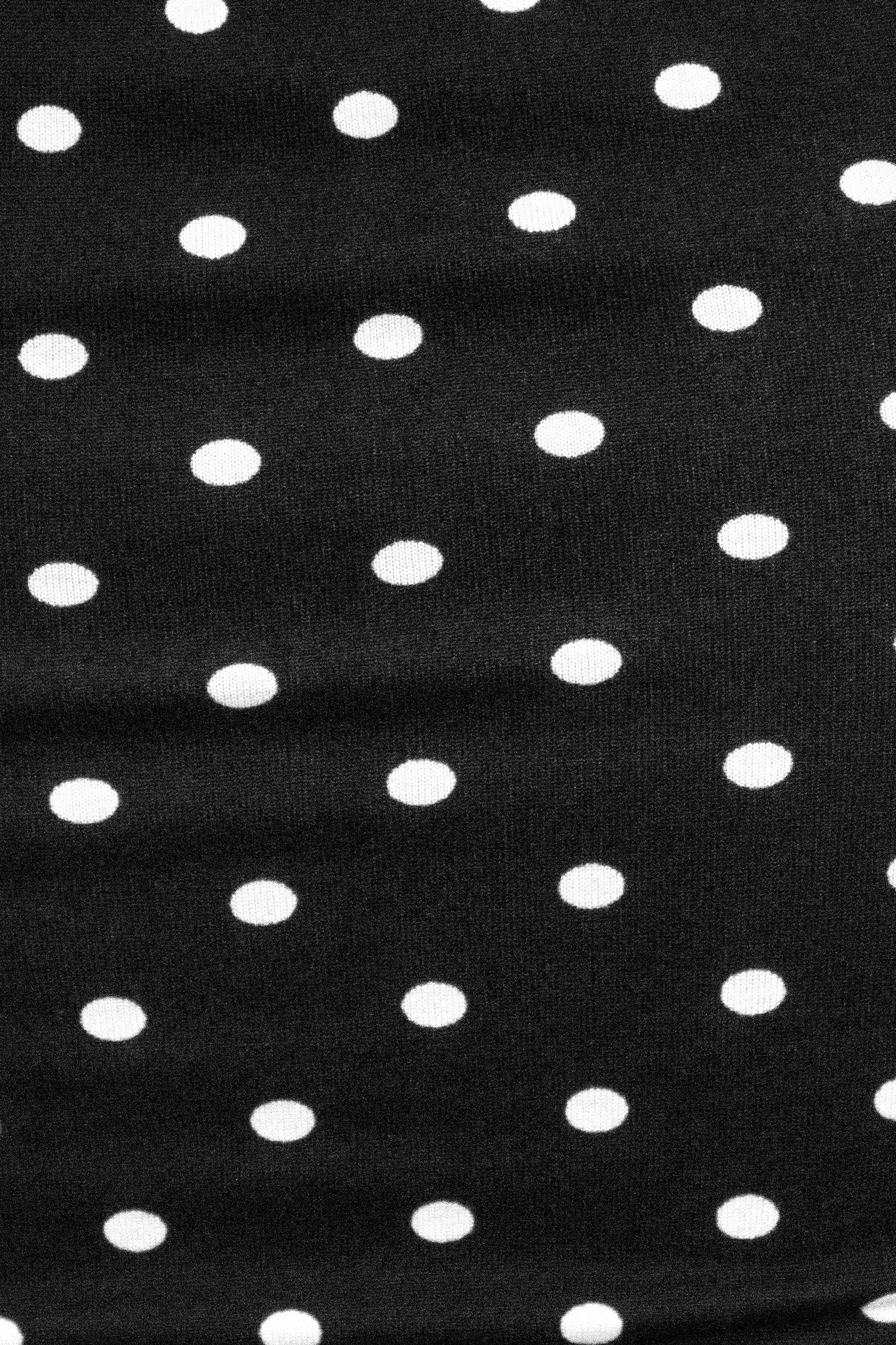 Black fabric with white polka dots
